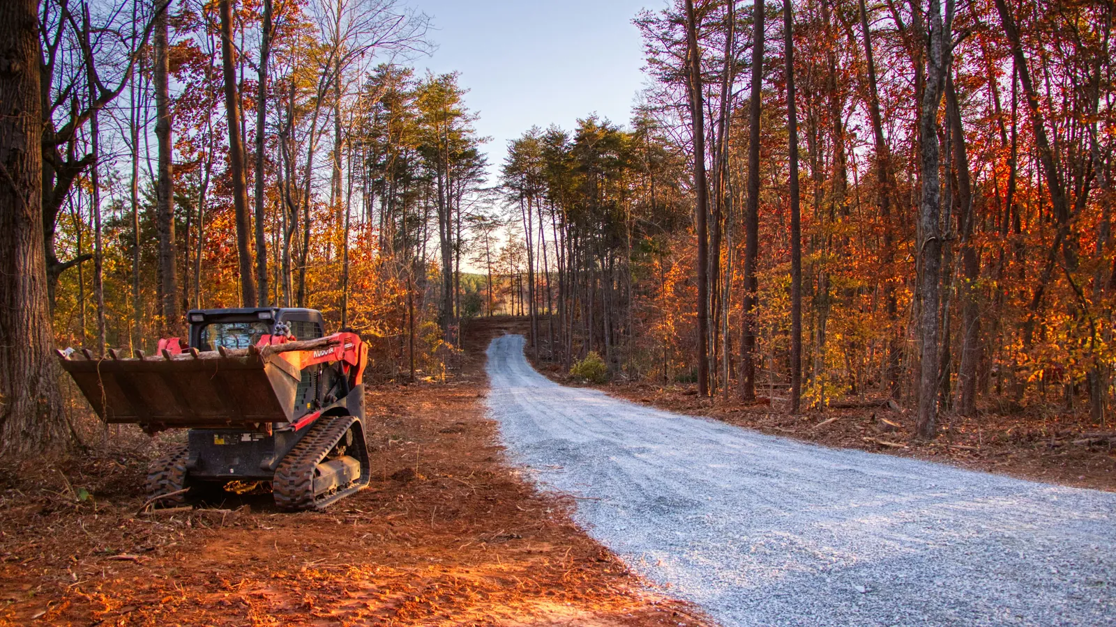 Track loader on a newly cleared road