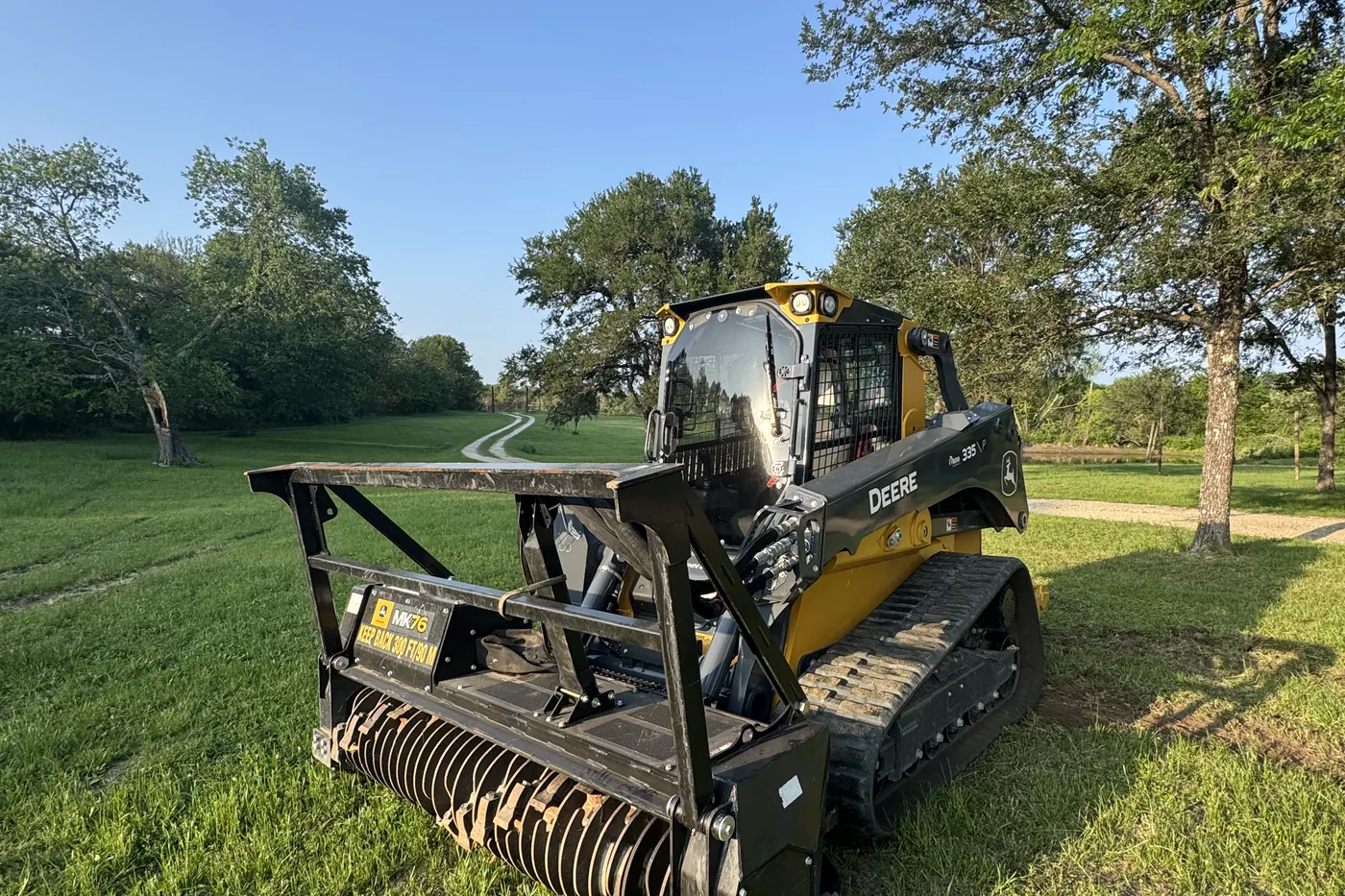 Compact track loader with a forestry mulching head